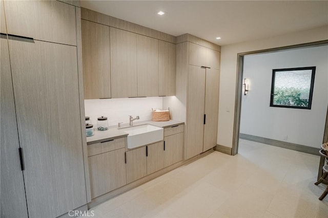 kitchen with sink and light brown cabinets