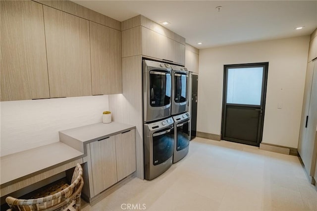 laundry room featuring laundry area, recessed lighting, stacked washer and clothes dryer, and baseboards