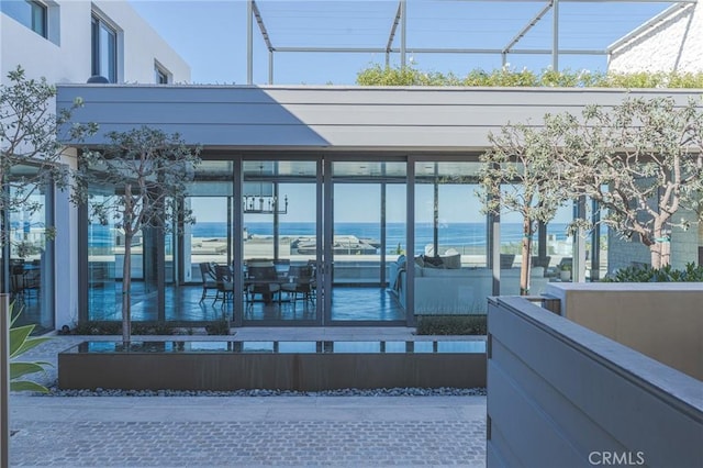 view of patio with a water view