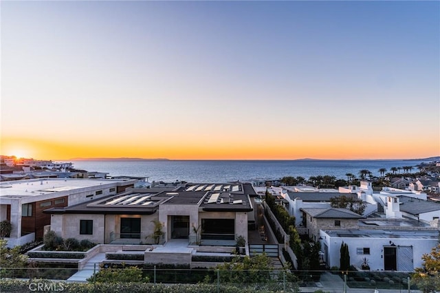 aerial view at dusk with a water view