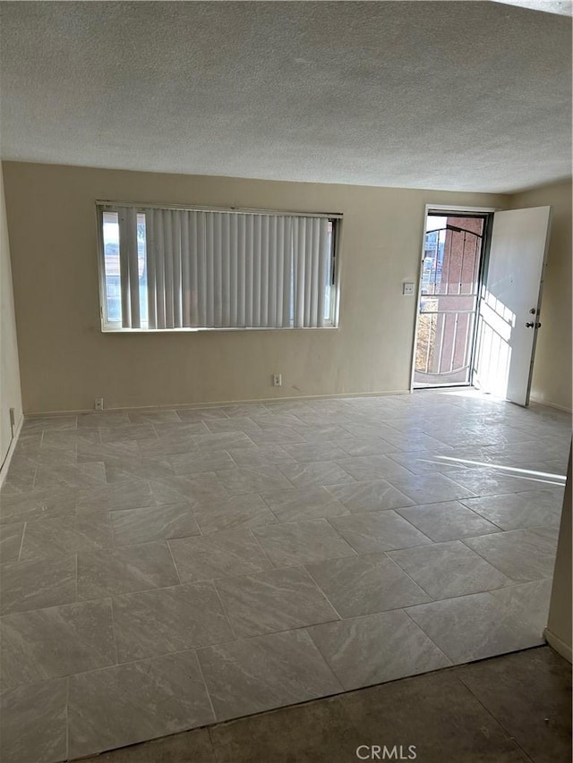 empty room with a textured ceiling