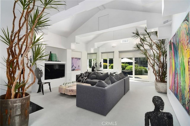 carpeted living room with lofted ceiling