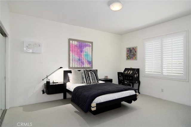 bedroom with light carpet