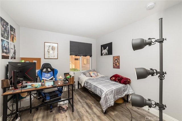 bedroom featuring hardwood / wood-style floors