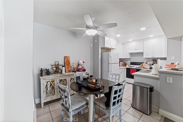 kitchen with ceiling fan, light tile patterned floors, white cabinets, and white appliances