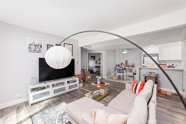 living room featuring hardwood / wood-style flooring and ceiling fan