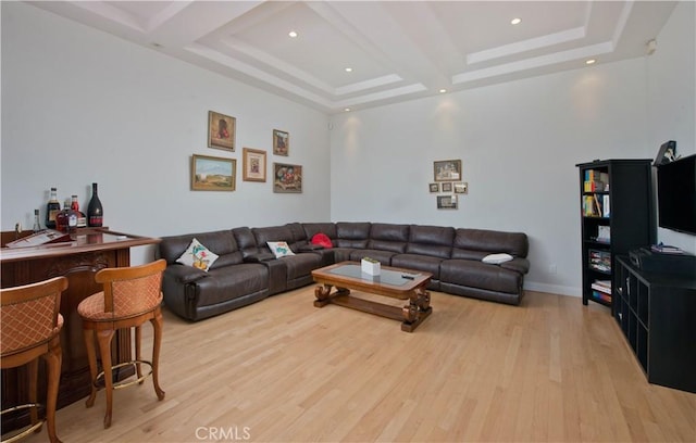 living room featuring light hardwood / wood-style flooring and bar area