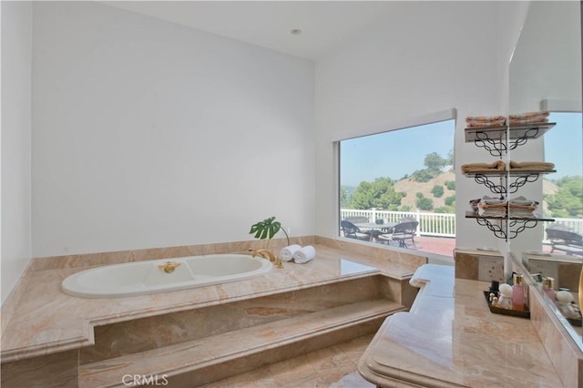 bathroom with tiled bath