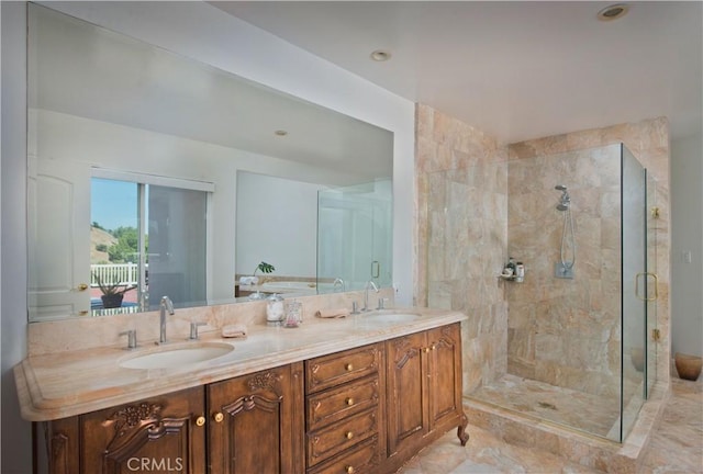 bathroom featuring vanity and an enclosed shower