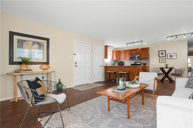 living room with dark hardwood / wood-style floors