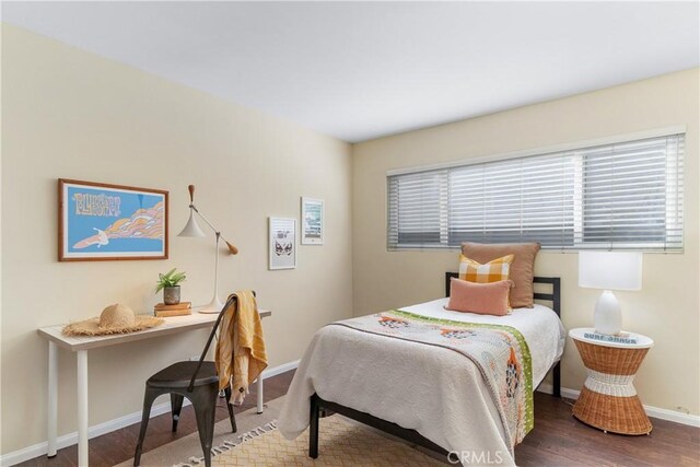 bedroom featuring dark hardwood / wood-style flooring