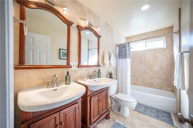 full bathroom featuring tile walls, tile patterned flooring, backsplash, vanity, and shower / bath combination with curtain