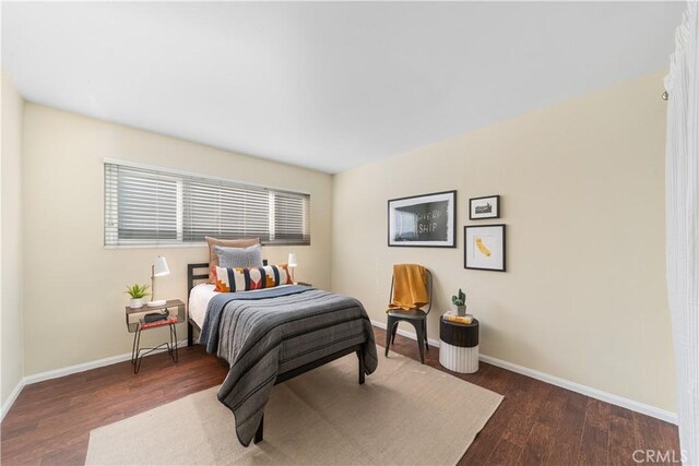 bedroom featuring dark hardwood / wood-style floors