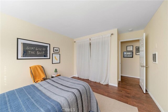 bedroom featuring dark wood-type flooring