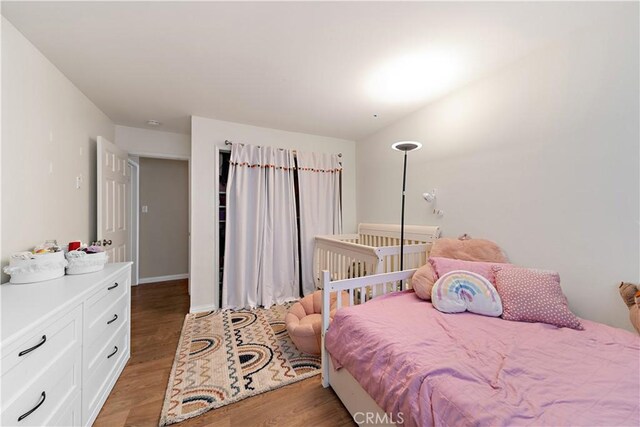 bedroom featuring hardwood / wood-style floors