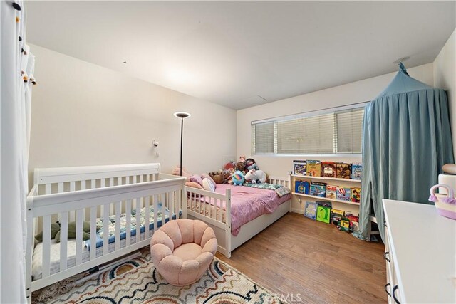 bedroom with light hardwood / wood-style flooring