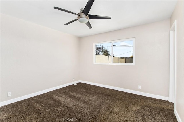 unfurnished room featuring ceiling fan and carpet flooring