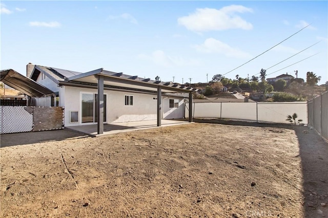 rear view of house featuring a patio area