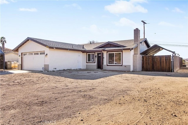 single story home featuring a garage