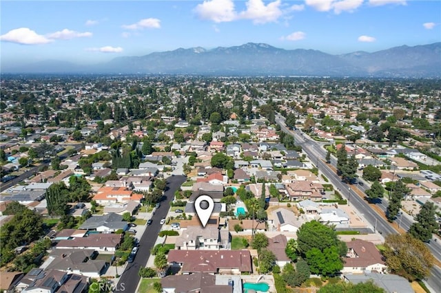 birds eye view of property featuring a mountain view