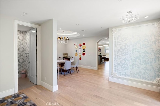 interior space featuring a chandelier and light wood-type flooring