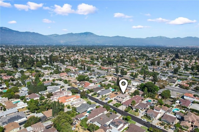 birds eye view of property featuring a mountain view