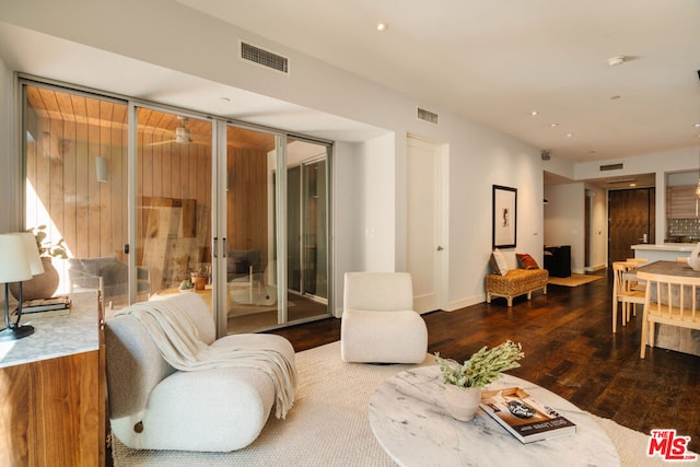 living room with dark hardwood / wood-style floors