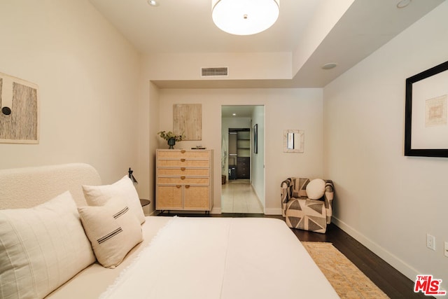 bedroom featuring dark wood-type flooring