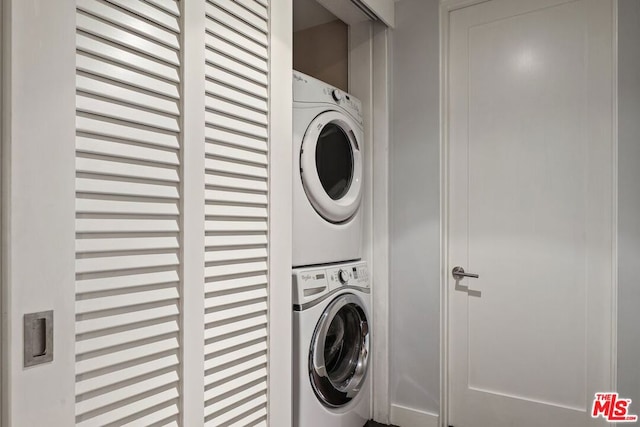 washroom with stacked washer and dryer