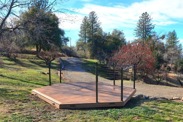 wooden terrace with a yard