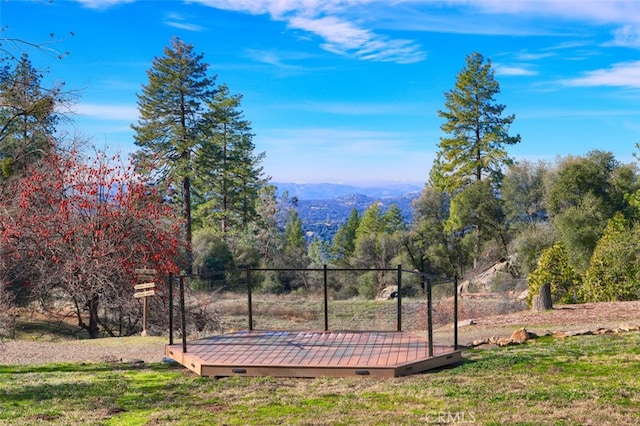 exterior space featuring a deck with mountain view