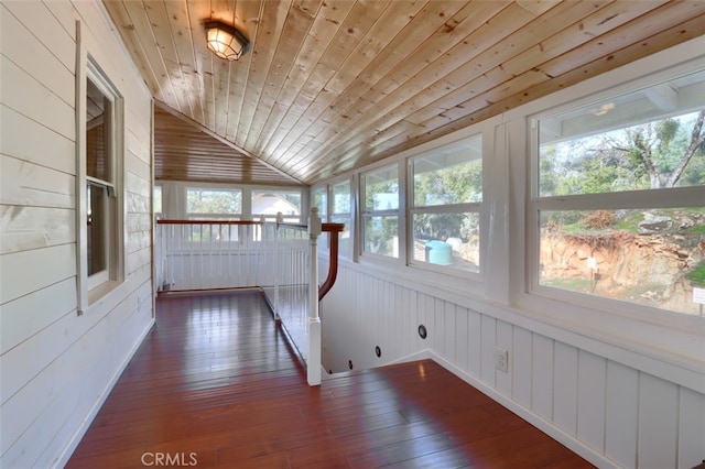 unfurnished sunroom with vaulted ceiling and wood ceiling