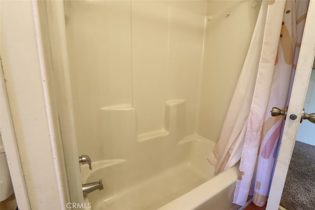 bathroom with shower / tub combo with curtain