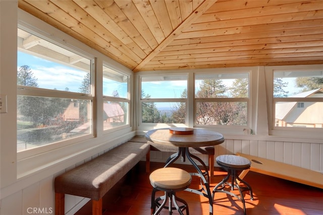 sunroom with lofted ceiling and wooden ceiling