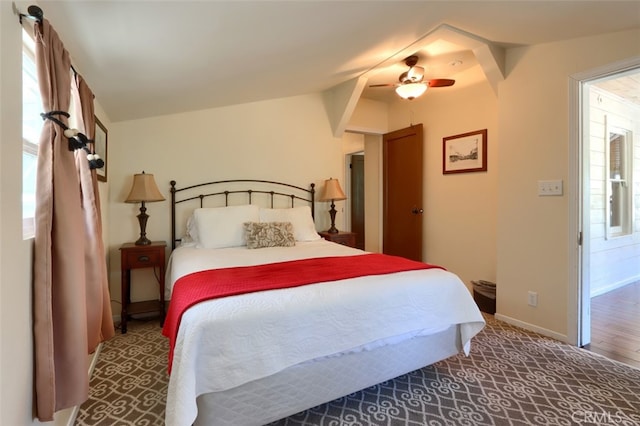 bedroom featuring ceiling fan and vaulted ceiling