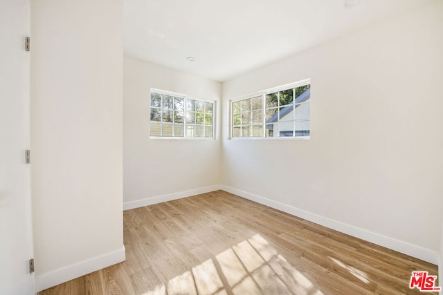 unfurnished room featuring light wood-type flooring