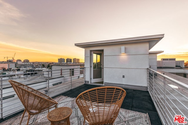 view of balcony at dusk