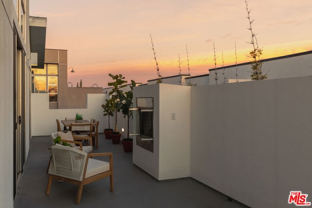 view of patio terrace at dusk