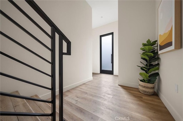 staircase with wood-type flooring