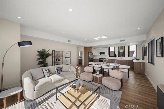 living room with light hardwood / wood-style floors