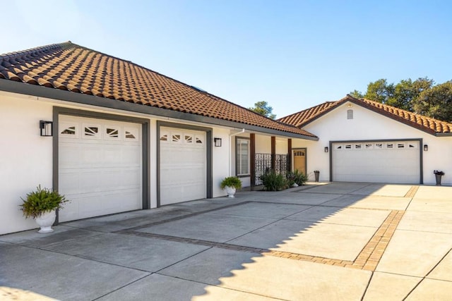 mediterranean / spanish house featuring a garage