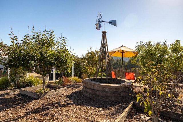 view of yard with an outdoor fire pit