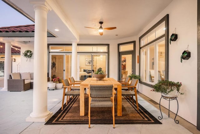 interior space with ornate columns, ceiling fan, and french doors