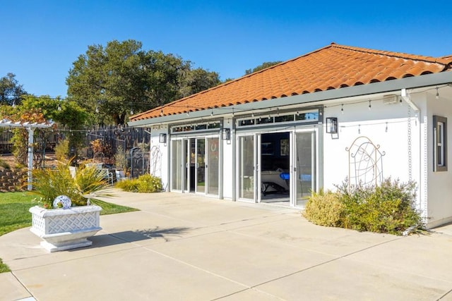 back of property featuring a patio area