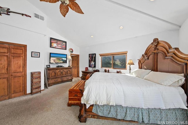 carpeted bedroom with vaulted ceiling and ceiling fan