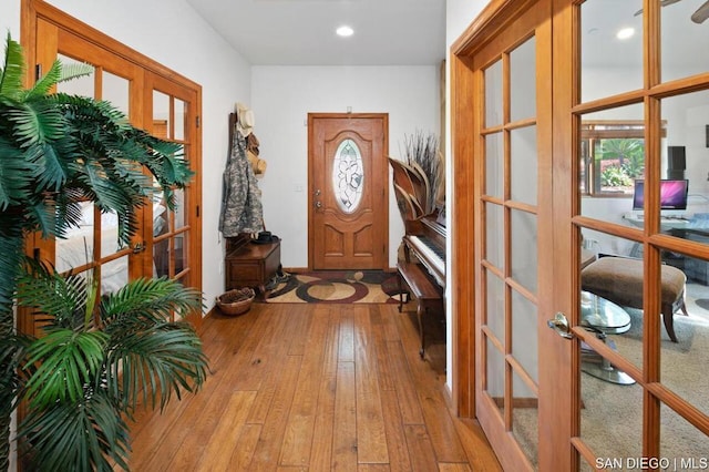 foyer featuring french doors and light hardwood / wood-style flooring