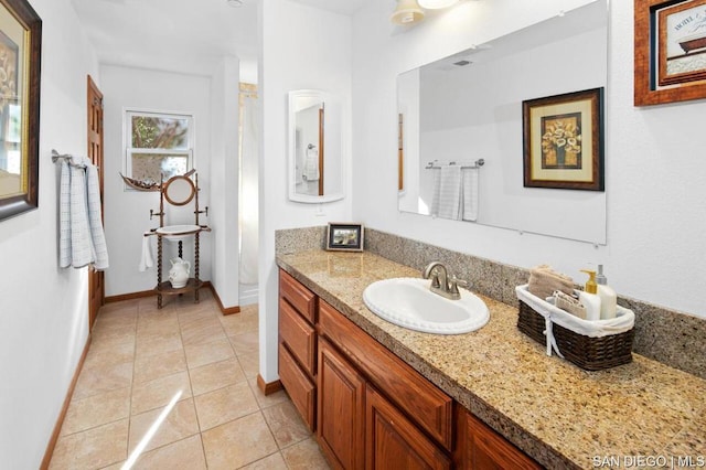 bathroom with vanity and tile patterned flooring