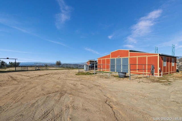 view of outbuilding with a rural view