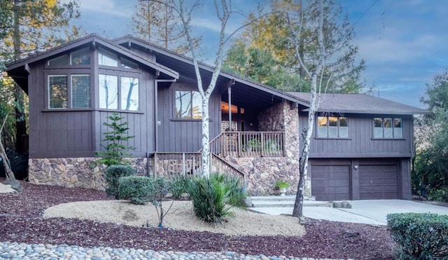 view of front of home with a garage and a porch