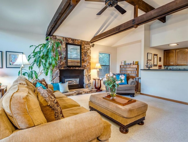 carpeted living room with ceiling fan, a stone fireplace, high vaulted ceiling, and beamed ceiling